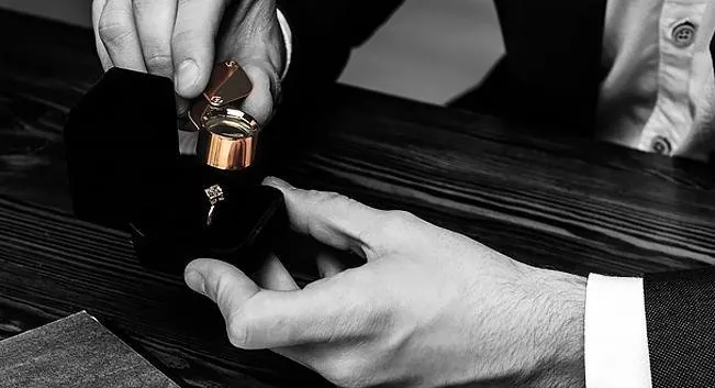 Specialist presenting a ring in a box